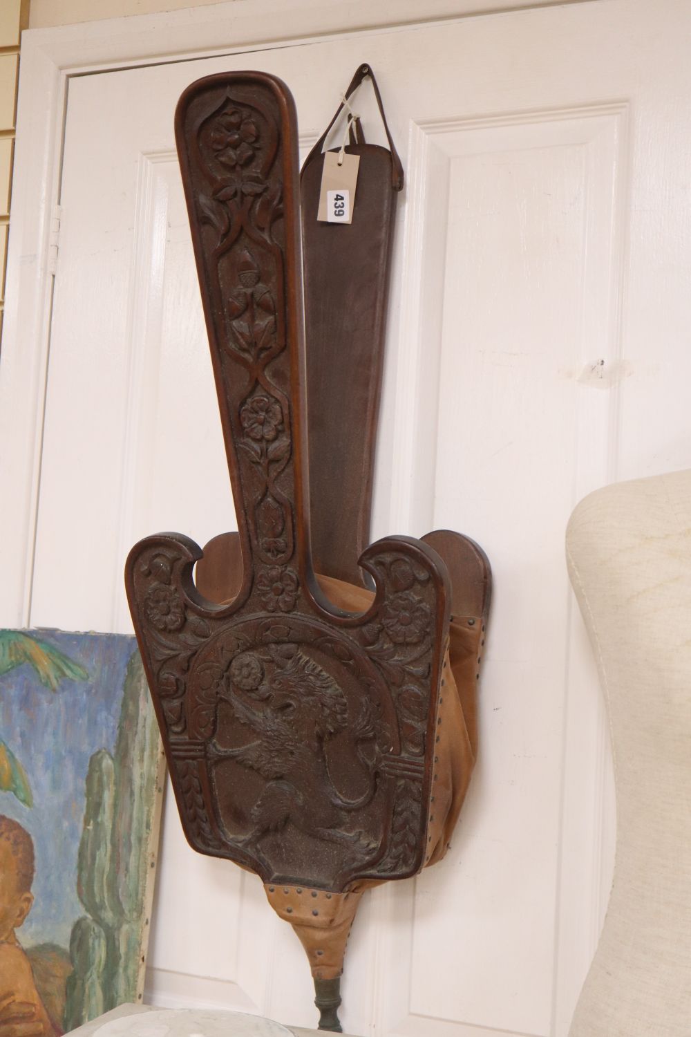 A large pair of carved oak fire bellows